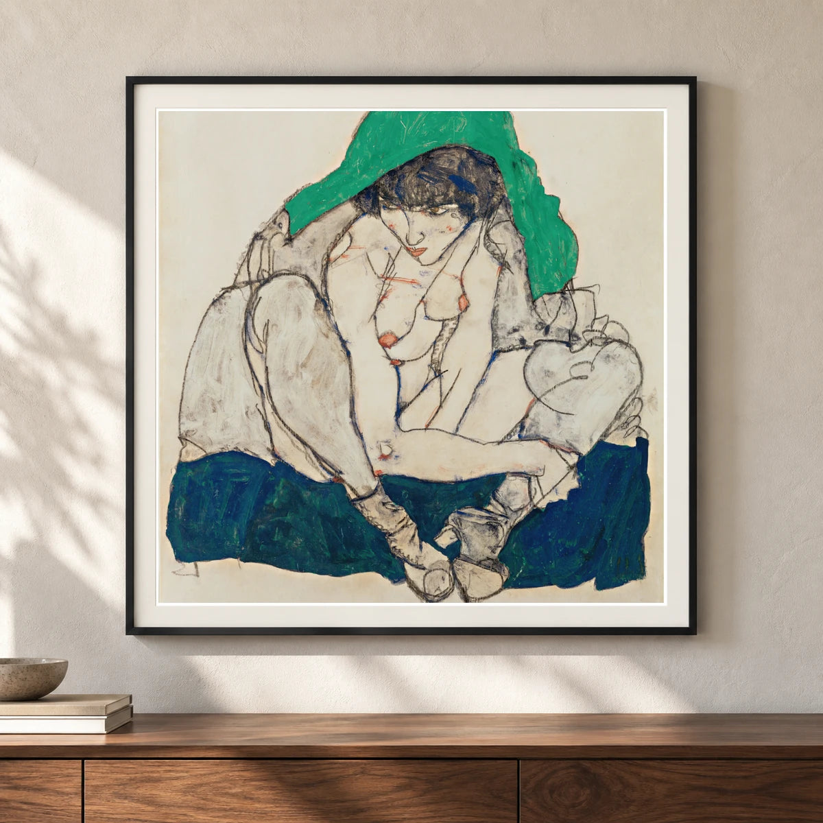 Crouching Woman With Green Headscarf (1914) — Egon Schiele shown in a styled interior