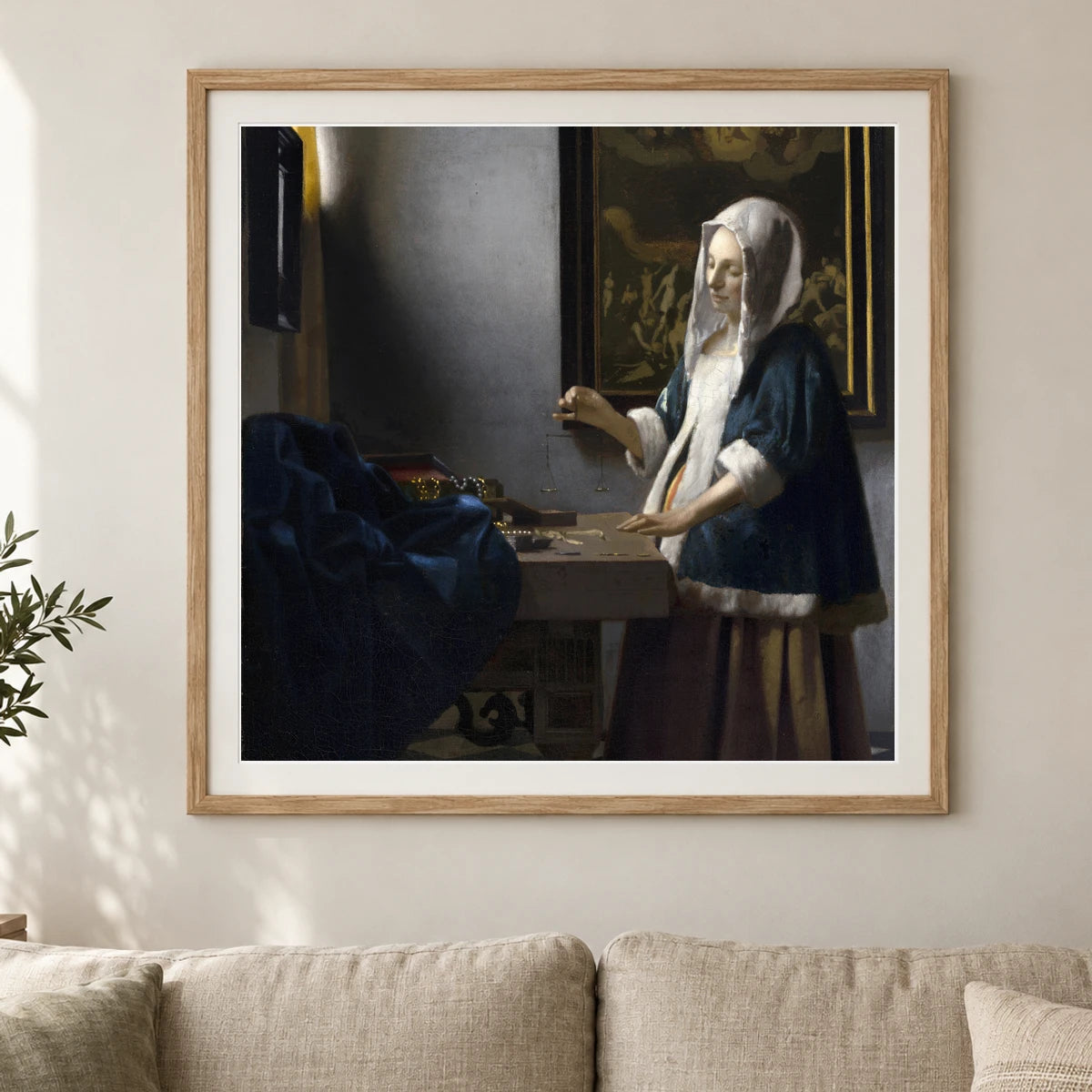 Woman Holding A Balance (c. 1664) — Johannes Vermeer shown in a styled interior