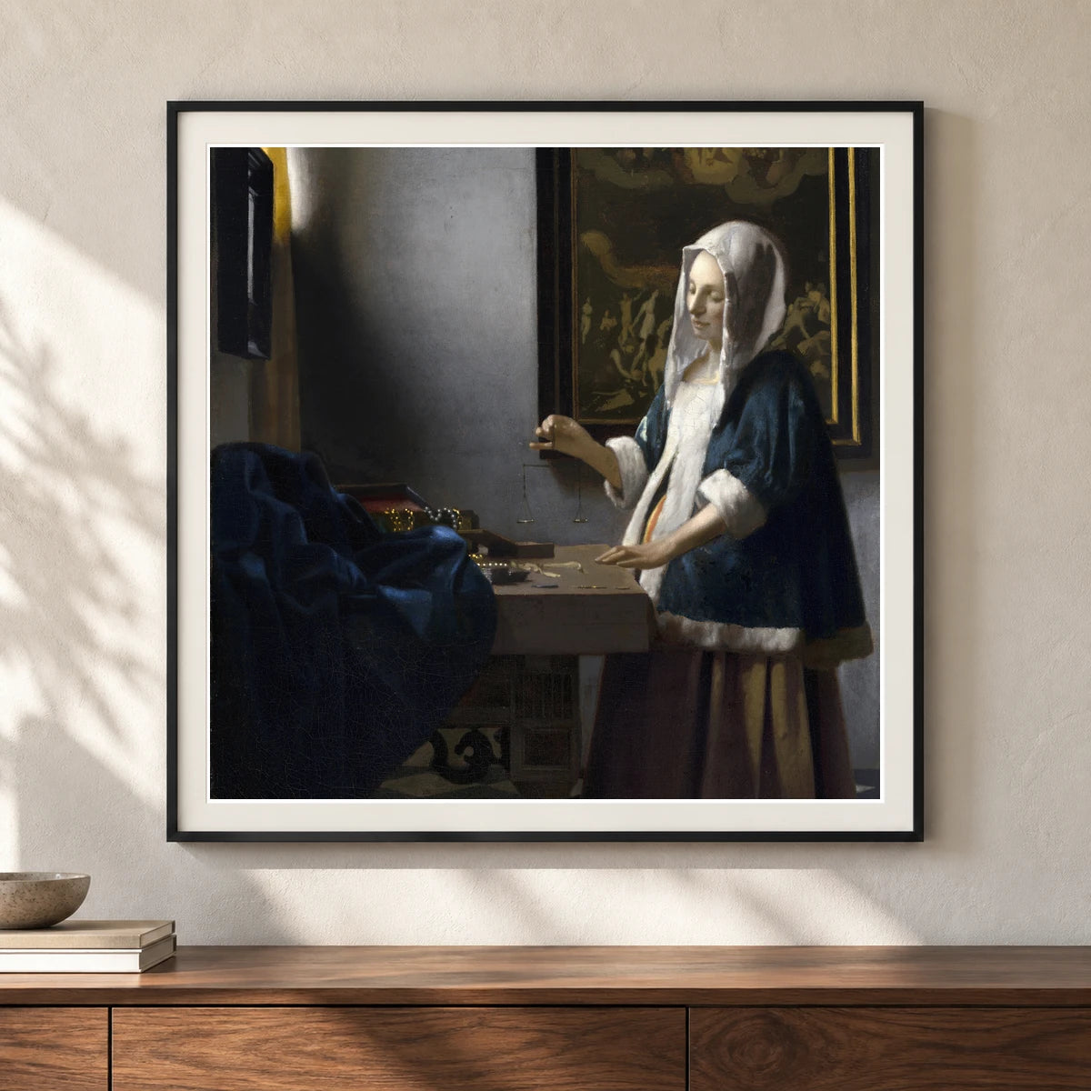 Woman Holding A Balance (c. 1664) — Johannes Vermeer shown in a styled interior