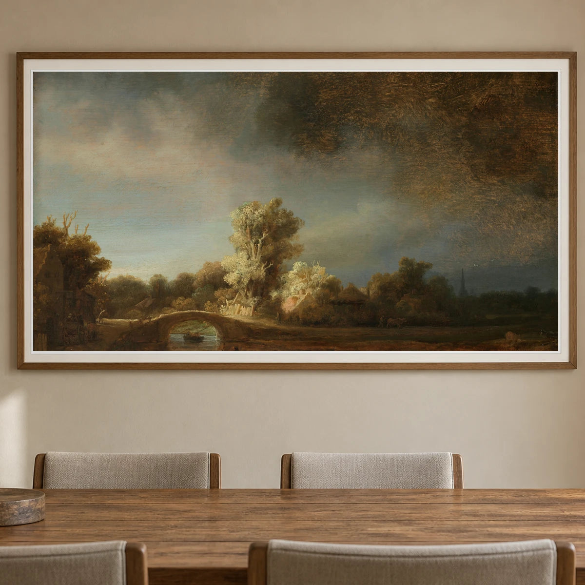 Landscape With A Stone Bridge (c. 1638) — Rembrandt van Rijn shown in a styled interior